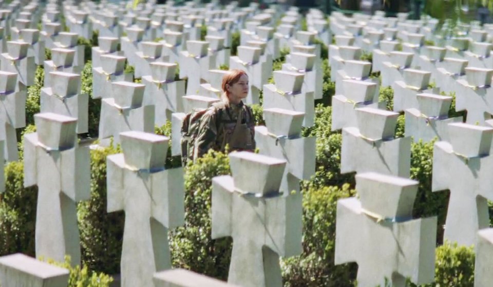 The heart-breaking clip also shows a soldier walking through a graveyard of tombstones