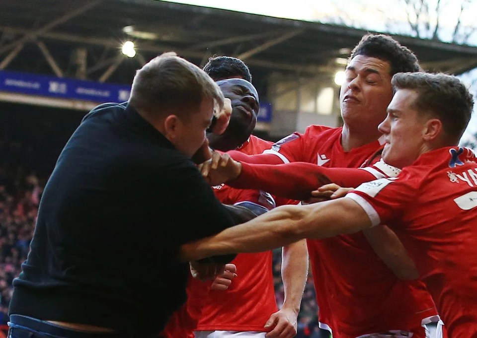 A Leicester fan invades the pitch to attack Nottingham Forest players earlier this year