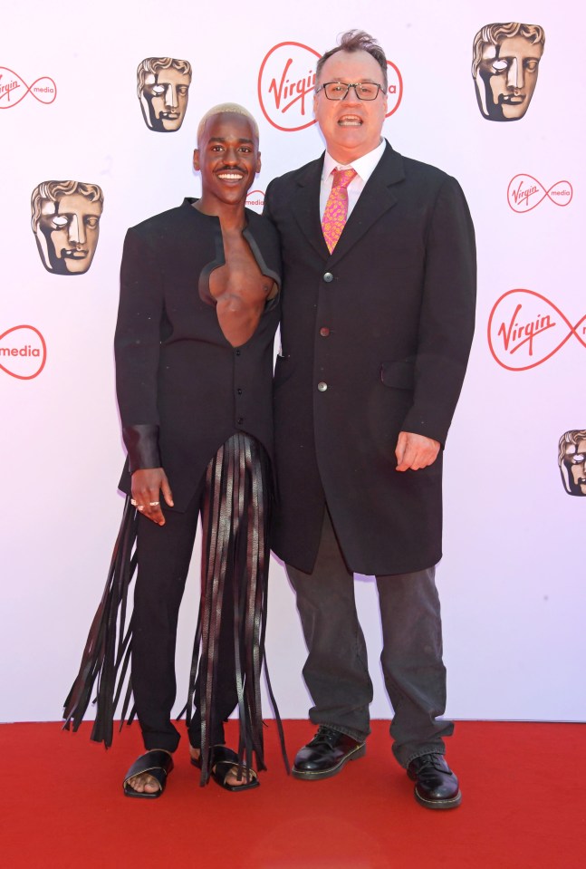 The 29-year-old poses with Doctor Who showrunner Russell T Davies