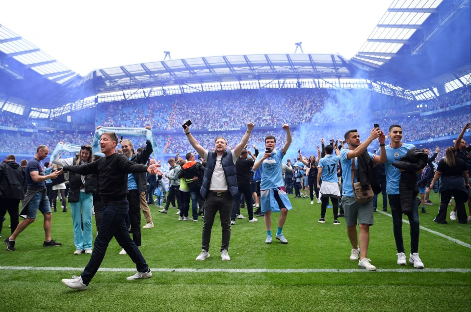 Man City fans swarmed the pitch with flares and flags after sealing the Premier League title late on at home to Aston Villa