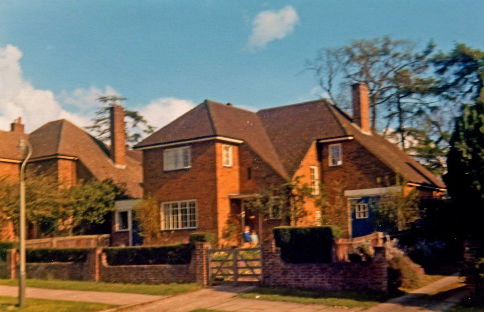 Philip and Leslie's children stood in front of their family home