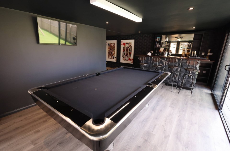 There is also a pool table and play area for his children