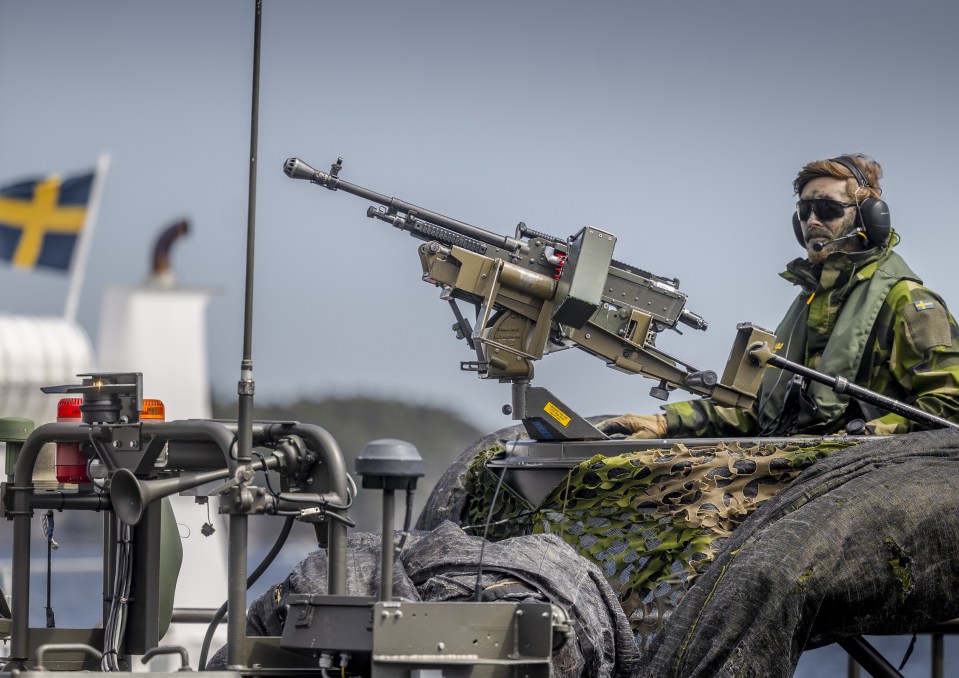 A soldier from Sweden manning a machinegun on the same war games