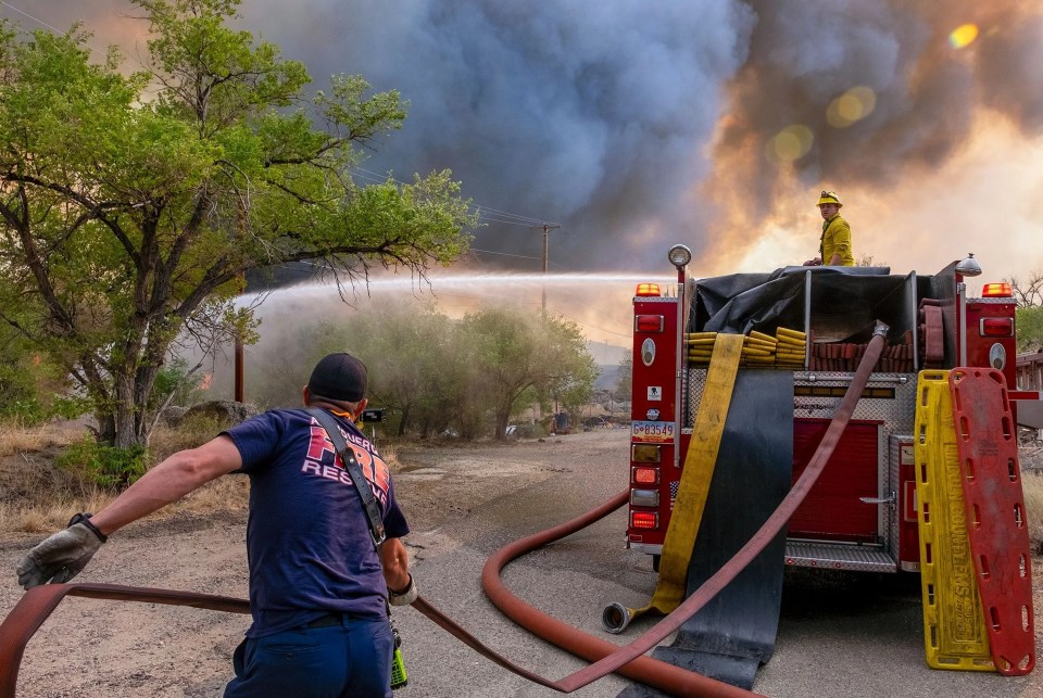 Firefights say that unseasonalably hot temps and windy condition is making their job difficult