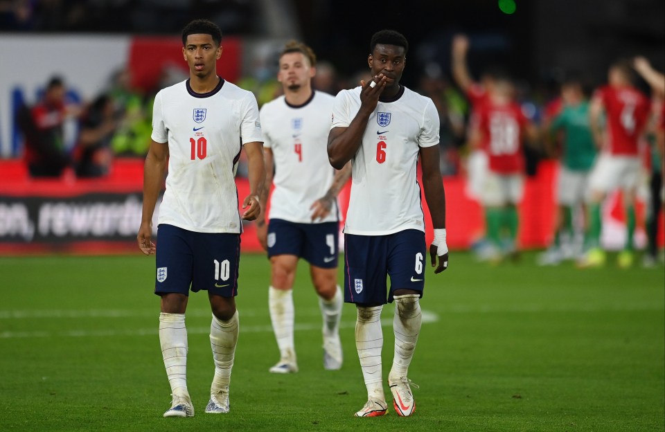 Jude Bellingham and Marc Guehi, with Kalvin Phillips behind, look stunned after Hungary blitzed to a 4-0 win at Molineux