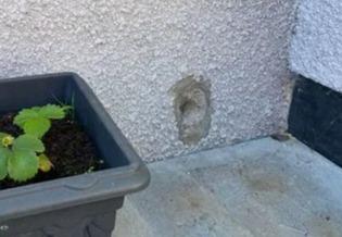 He drilled holes into his neighbour's new wall