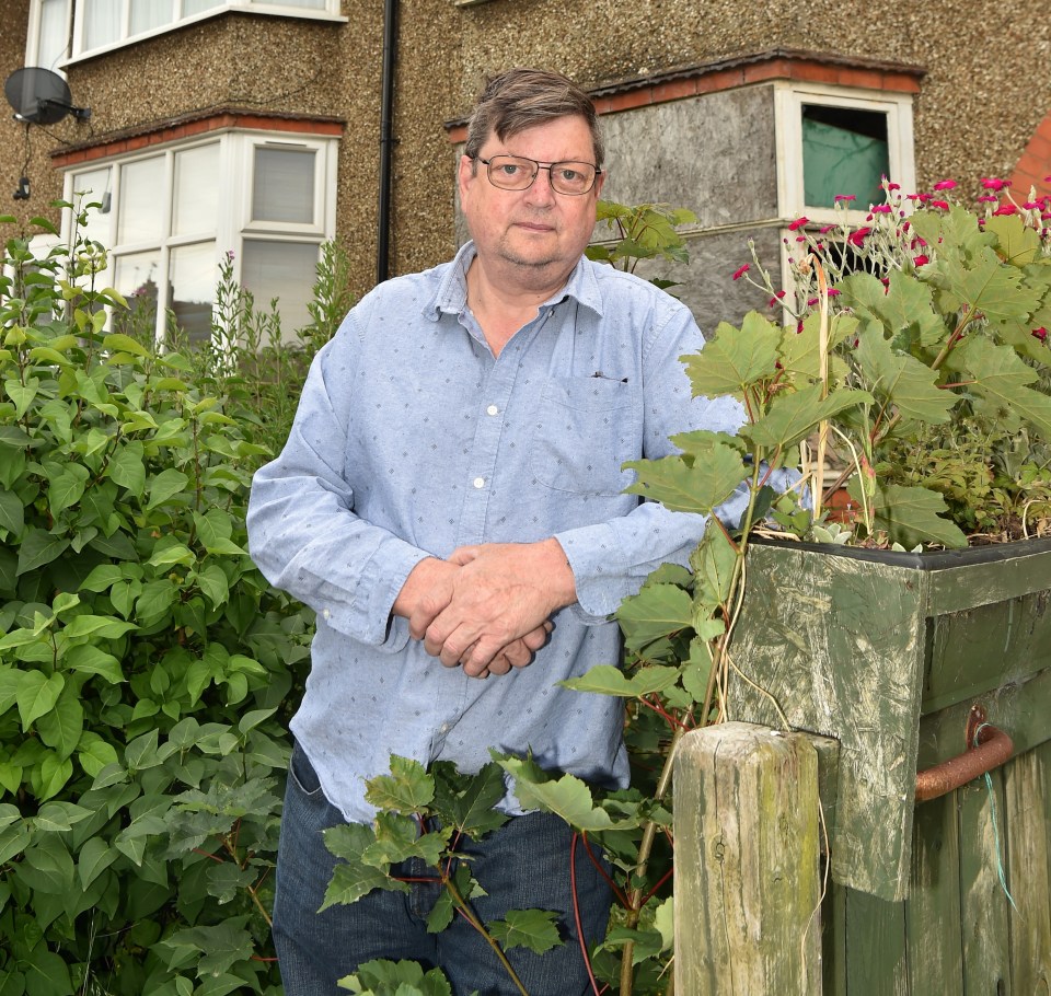 David Nicholls, 59, from Northampton is calling on West Northamptonshire Council to take control of the ‘rat hotel’ property next door