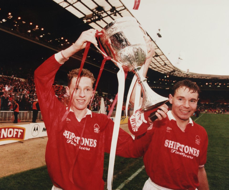 Scott Gemmill and Kingsley Black parade the Zenith Data Systems Cup they won in 1992