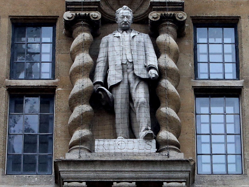 Students have been attempting to remove a statue of Cecil Rhodes from the front of Oriel College in Oxford