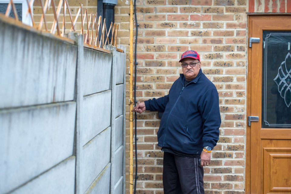 Herman Constantine pictured by part of the wall at the heart of the row