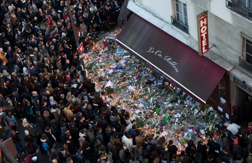 Floral tributes to the dead at a cafe