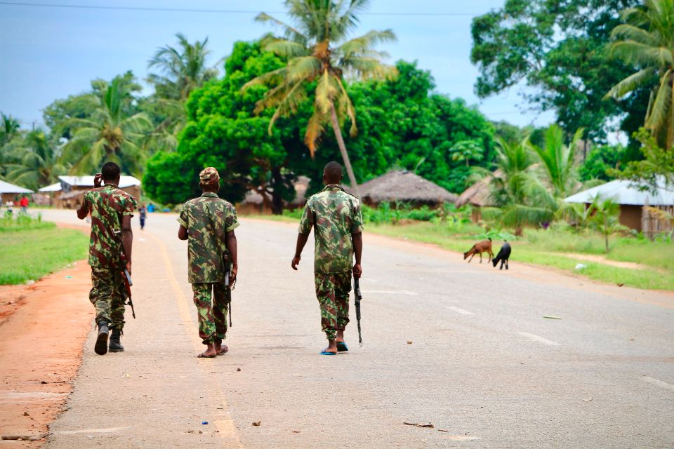 Soldiers from the Mozambican army patrol the streets after an attack