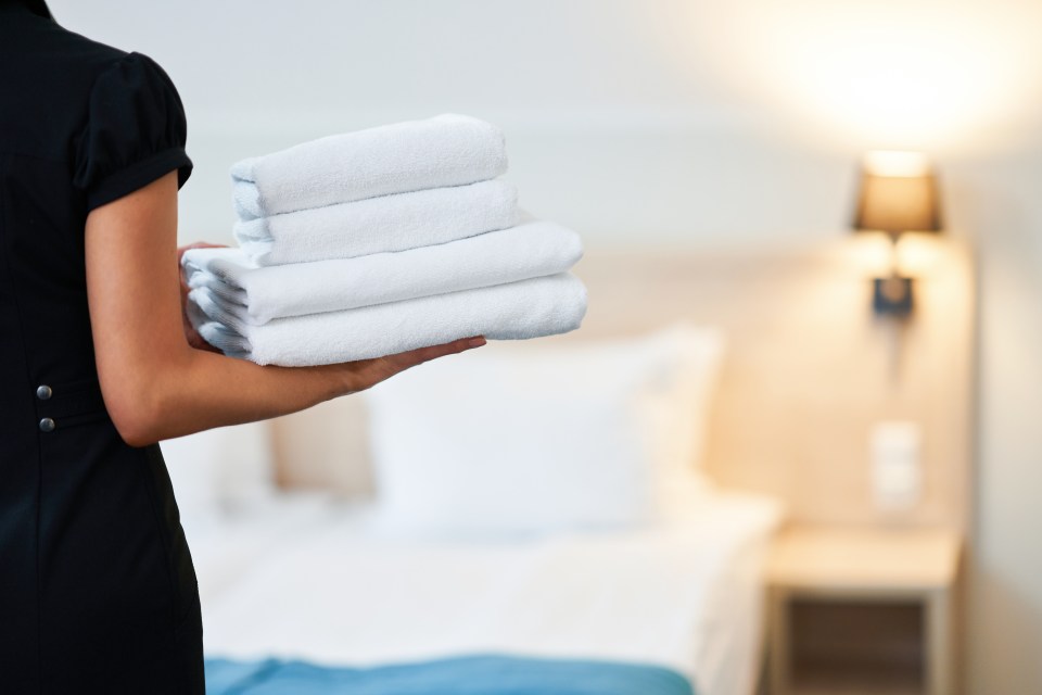 A woman sparked debate after she yelled at a cleaner for entering her hotel room at 8am