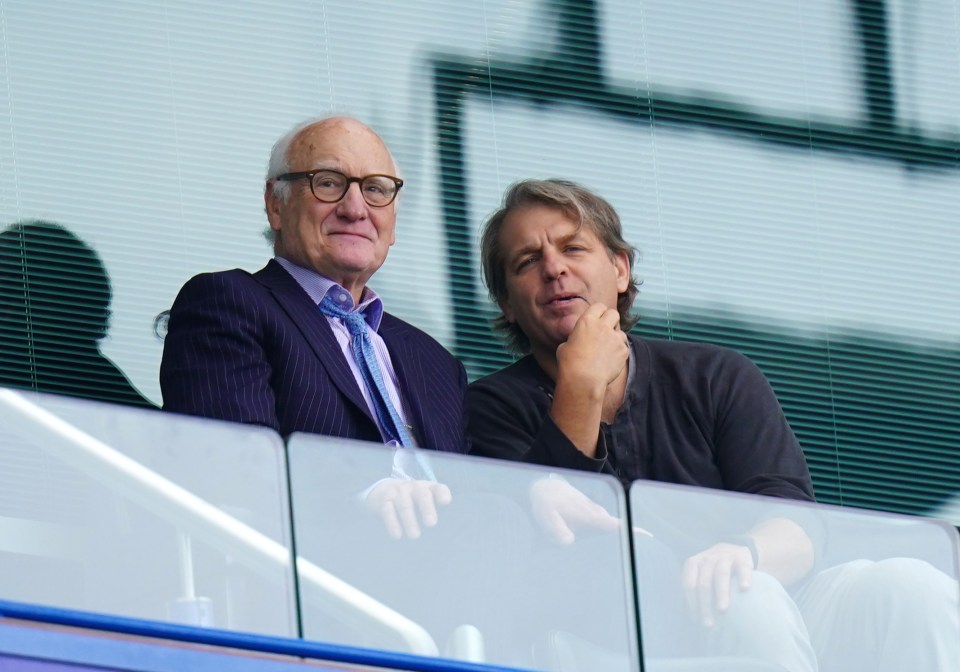 Bruce Buck watches a game alongside new owner Todd Boehly