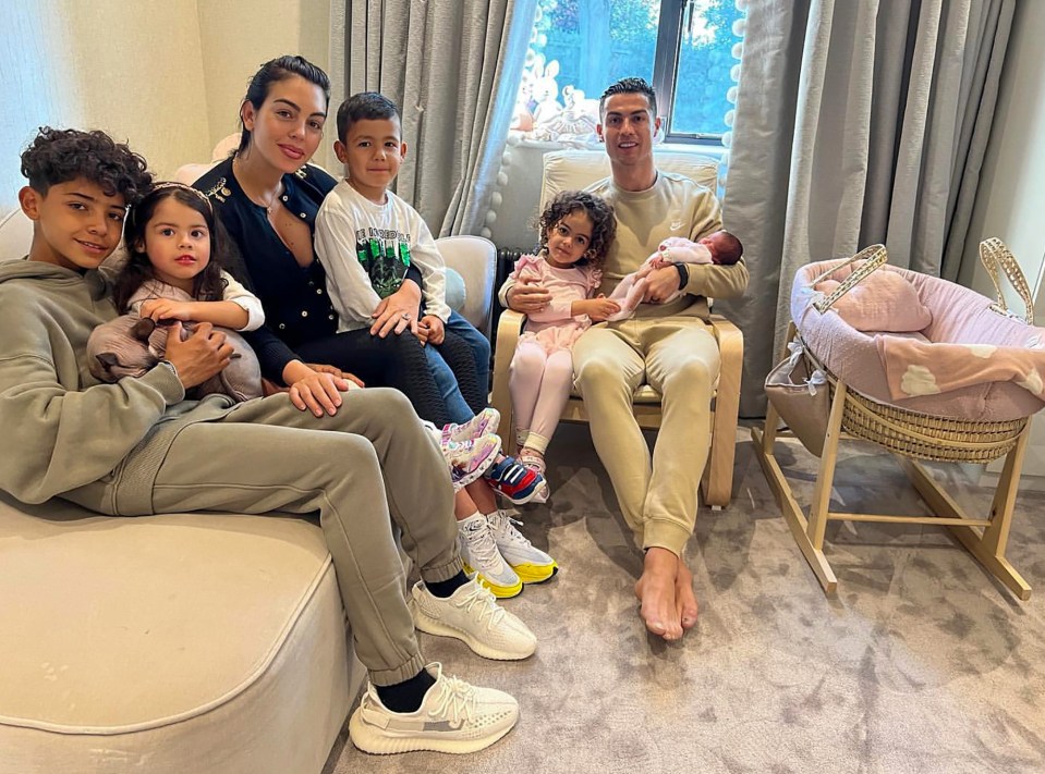 Georgina, 28, is pictured with their five children and Ronaldo after she returned home after giving birth in April to daughter Bella