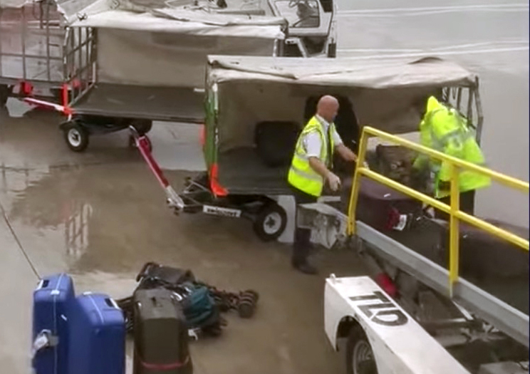 A Tui co-pilot was seen loading baggage at Manchester Airport after the flight was reportedly delayed for 32 hours