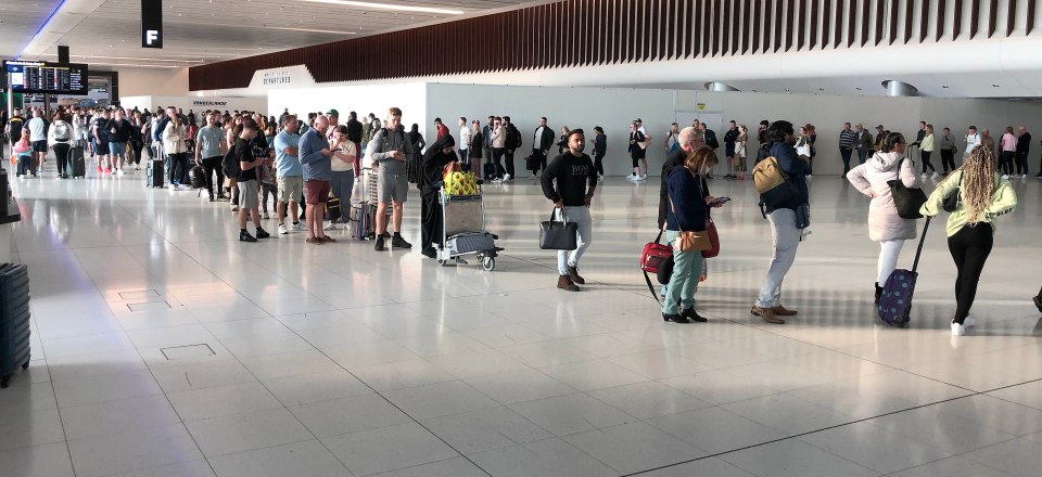 Winding queues at Manchester Airport this morning