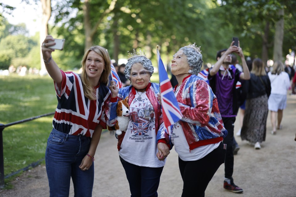 Royal fans in Queen Elizabeth masks get ready for Trooping the Colour