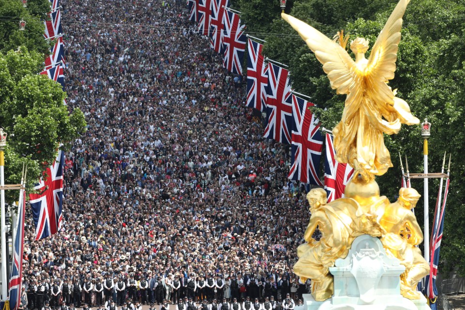 Thousands cheered Her Majesty as she and other royals marvelled at an RAF flypast