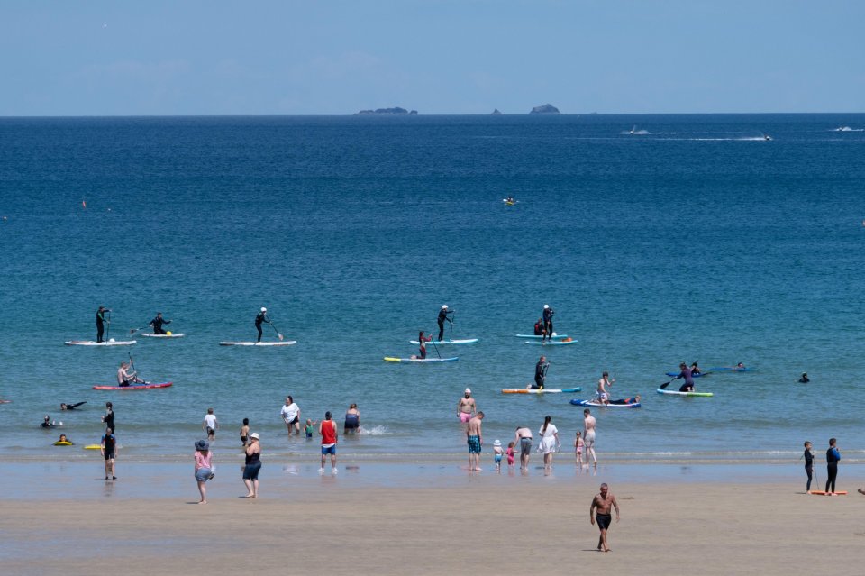 People out on the water in Newquay, Cornwall