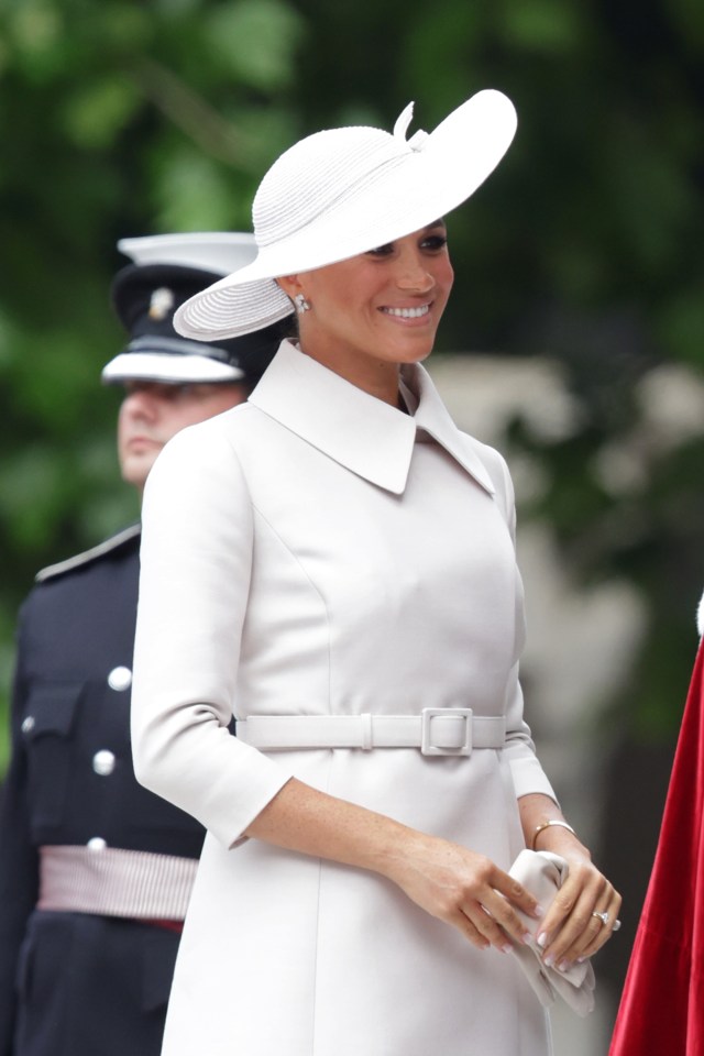 Meghan Markle looked chic in a cream dress coat