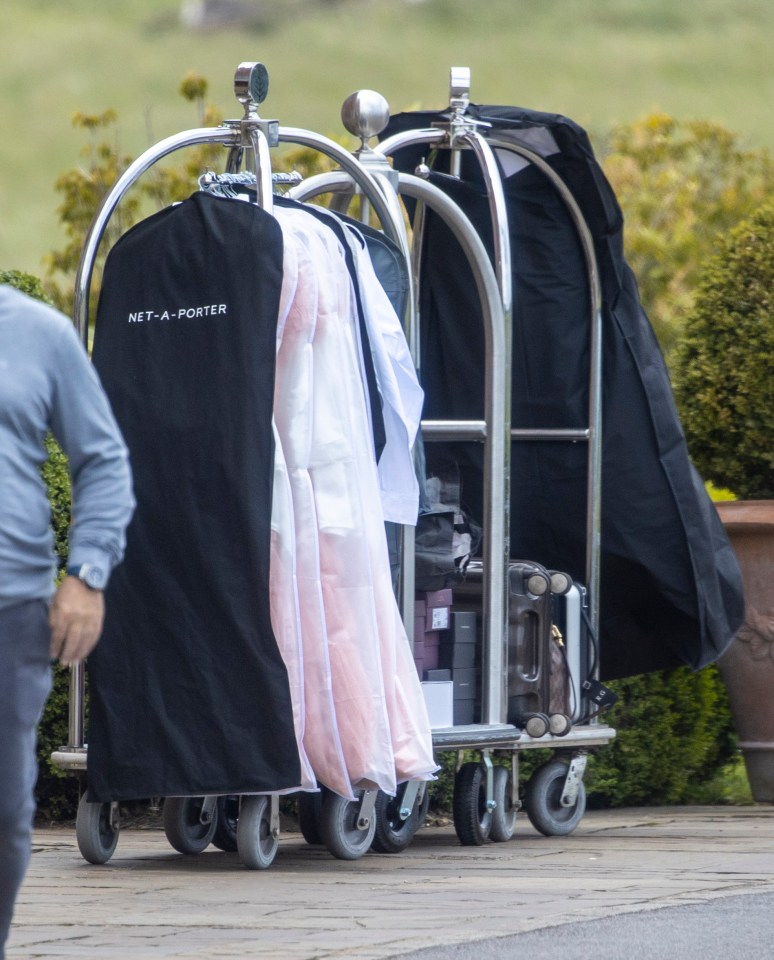 Dresses lined up on clothing rails were wheeled into the venue