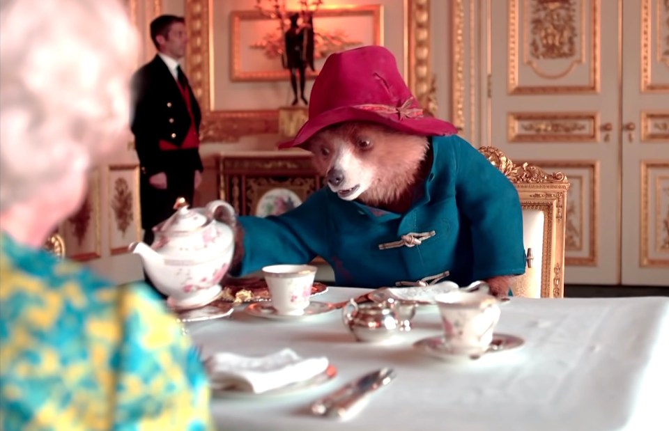 The short film sees Her Majesty enjoying a cream tea with the troublesome bear