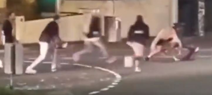 One group of men all began kicking a victim on the ground