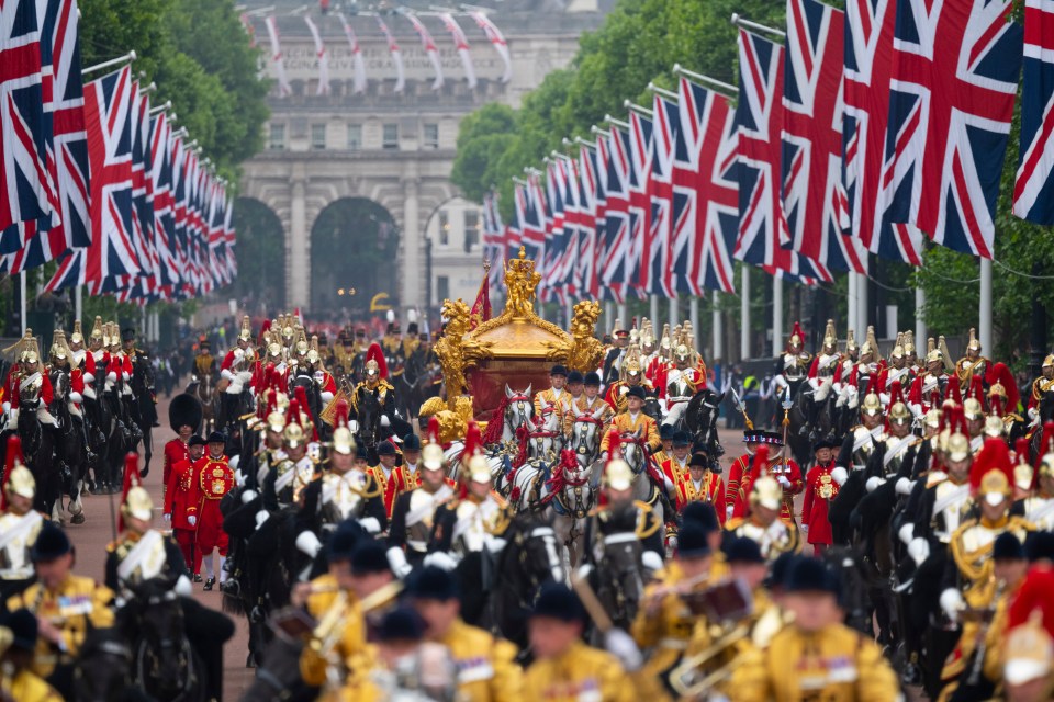 The Gold State Carriage, led by The Sovereign’s Escort, leads the Platinum Jubilee Pageant