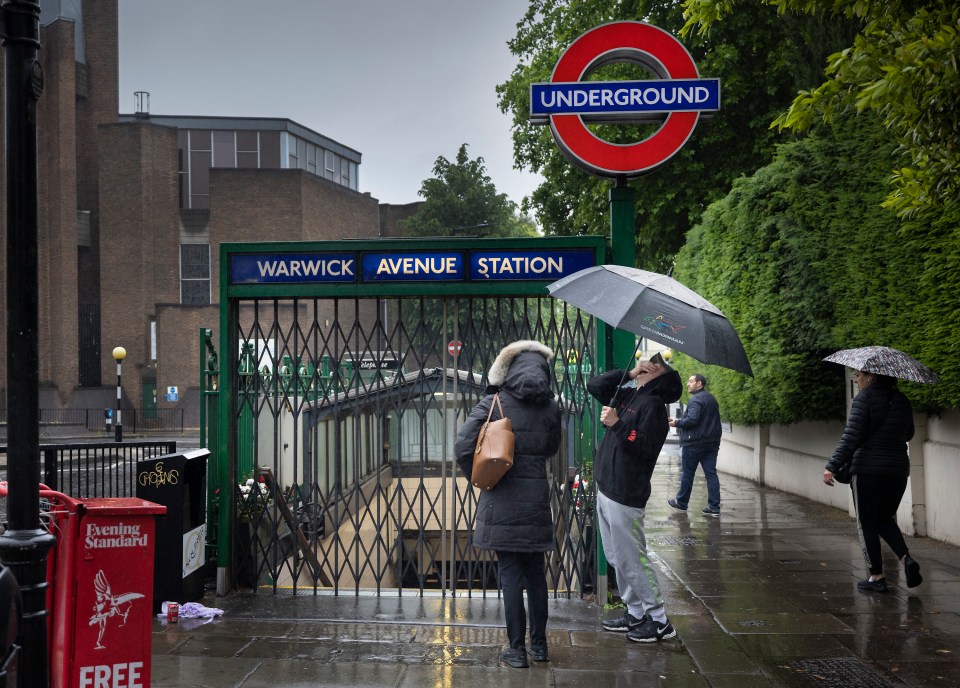 Sodden commuters realised tube strikes would dampen their day even further