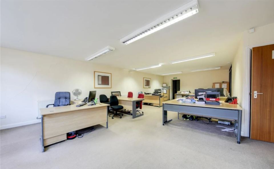 It is currently split into an open plan office and two flats