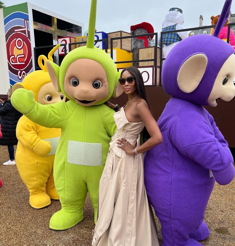 Naomi Campbell strikes a pose with the Teletubbies at the Jubilee People's Pageant