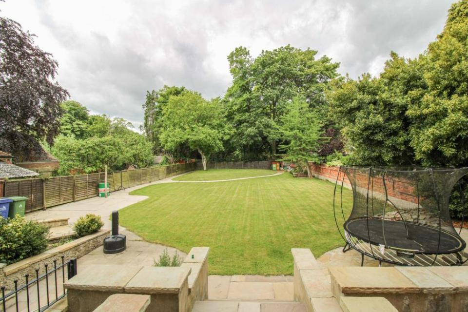 A sprawling walled garden stretches out the back of the property offering plenty of space for kids to have a kick about and throw a ball for a dog