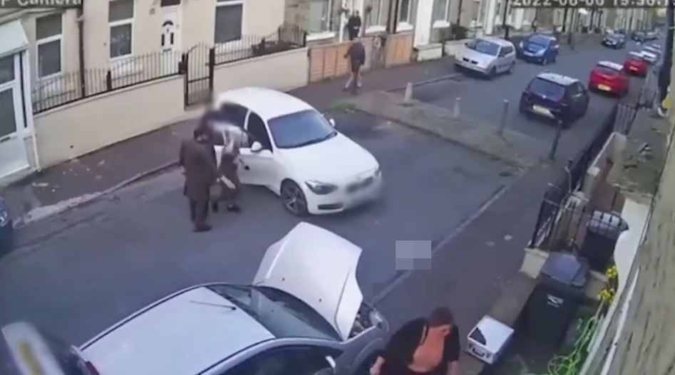 The couple confront the BMW driver in the street