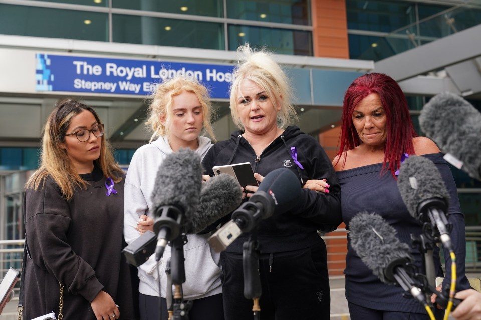 Hollie (centre-right) speaking outside the hospital in Whitechapel, east London