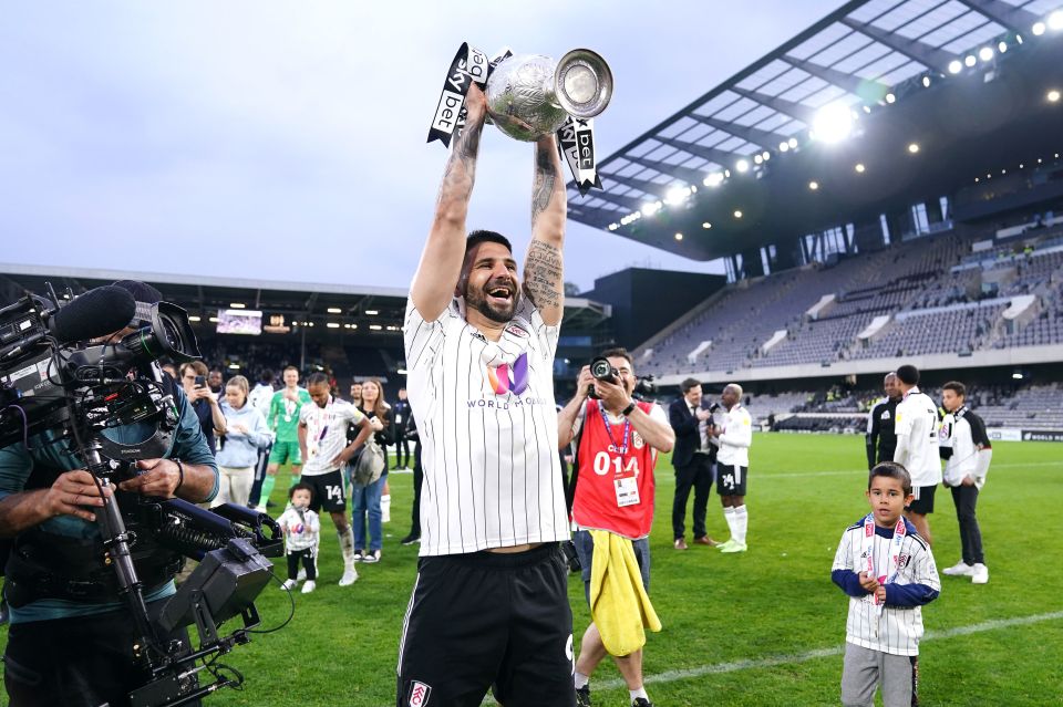 Fulham's Aleksandar Mitrovic lifts the 2021/22 Championship league title