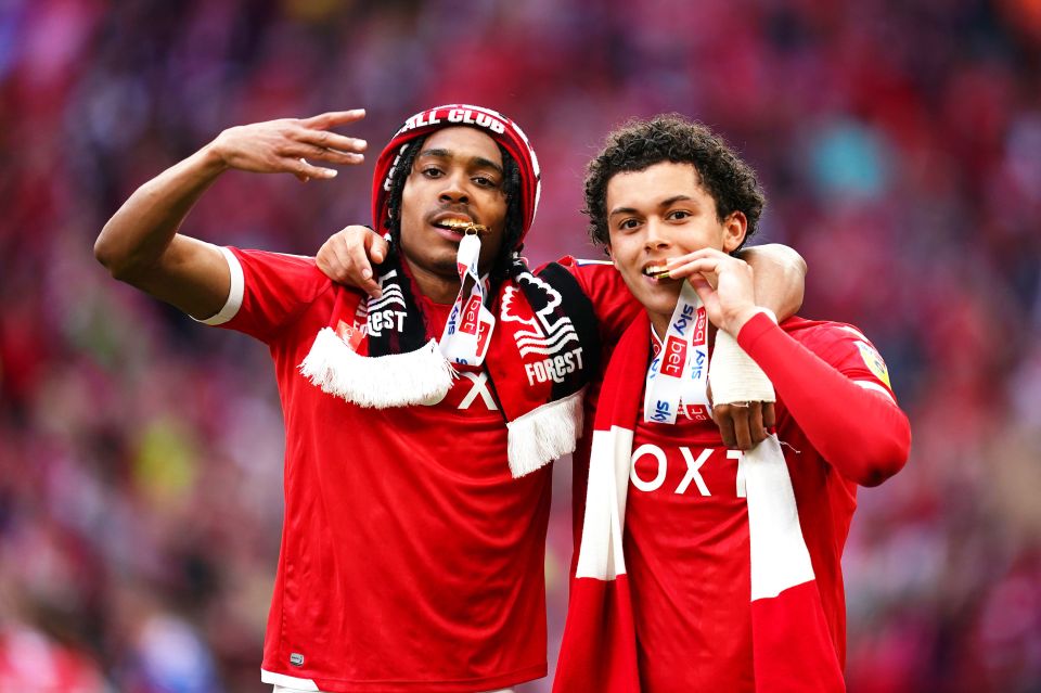 Spence (L) alongside Brennan Johnson (R) celebrate winning promotion with Nottingham Forest