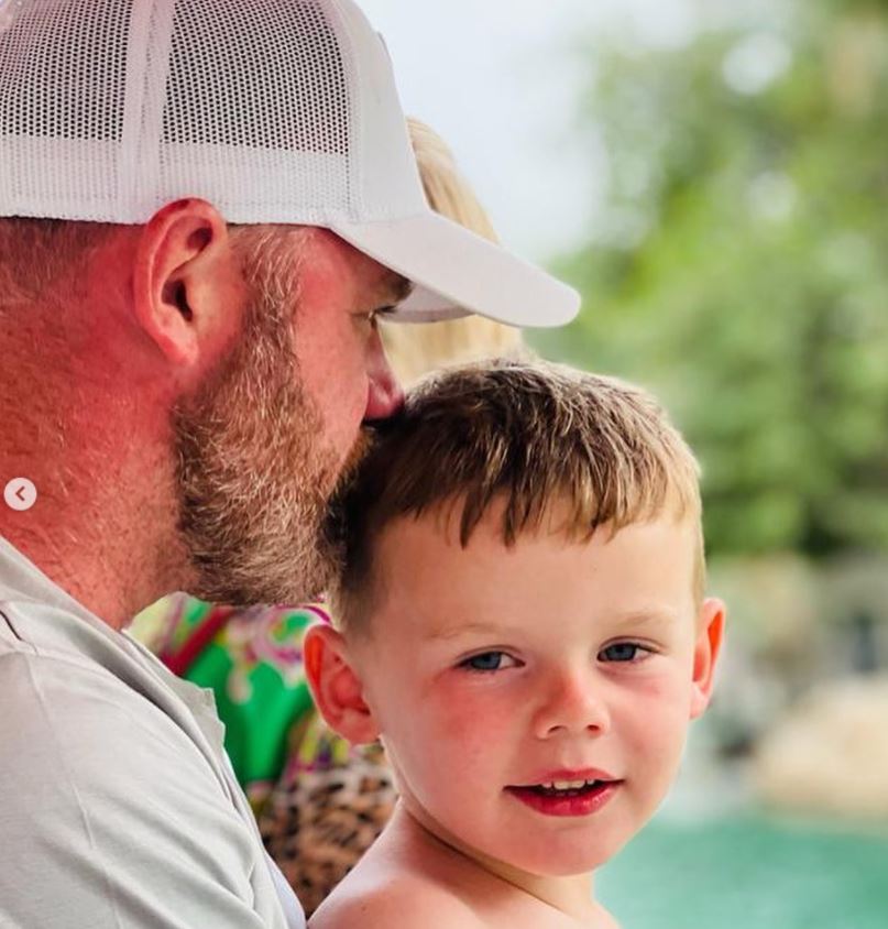 Wayne shared sweet holiday snaps kissing his son