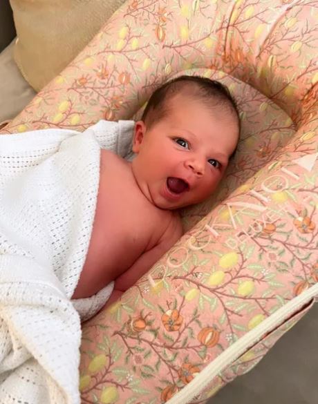 Lucy Meck shared a picture of their new baby writing 'I finally have a name'