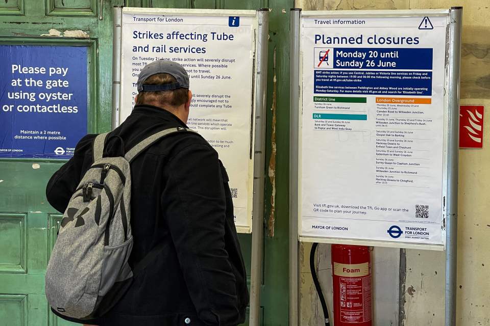 A passenger studies info regarding planned closures on the Tube