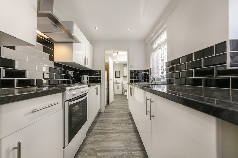 The newly fitted kitchen is no wider than a train carriage