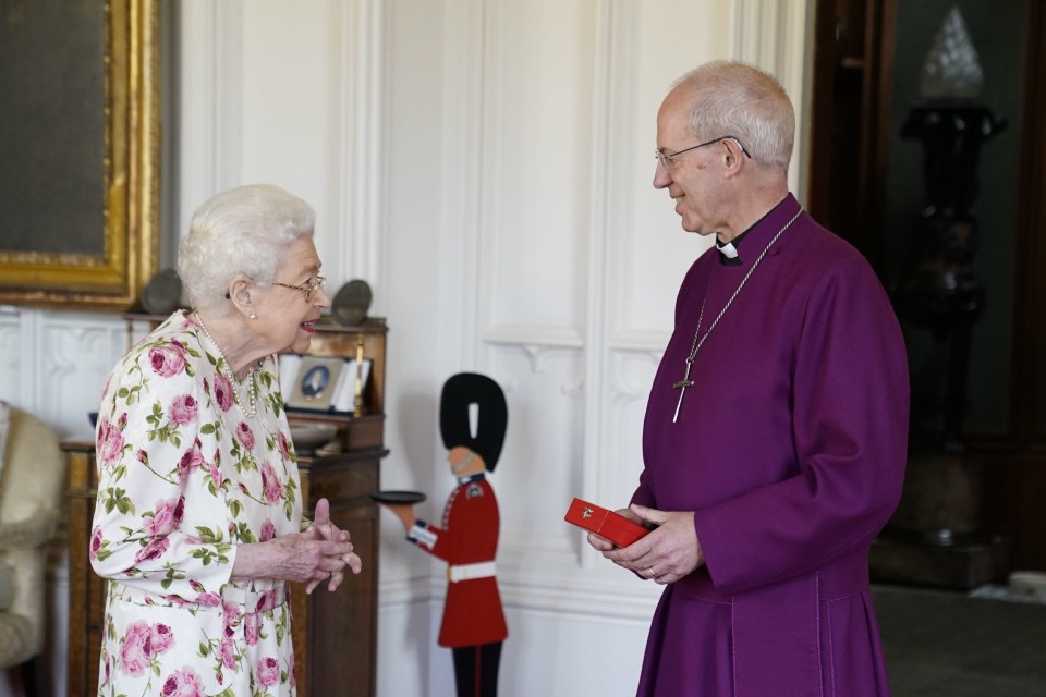 The Queen beamed as she received a Canterbury Cross from Archbishop Justin Welby