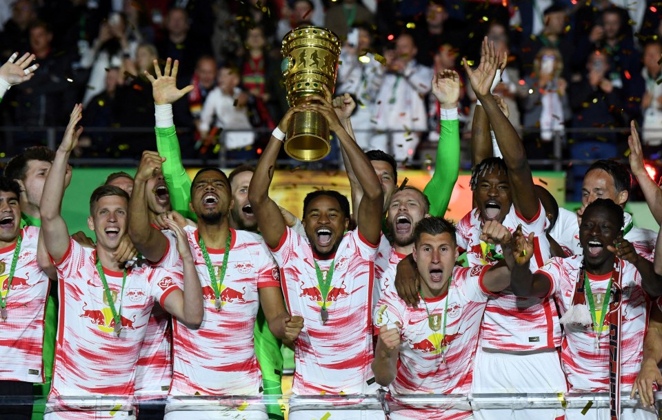 Nkunku (C) lifts RB Leipzig's first ever DFB-Pokal after scoring in the final