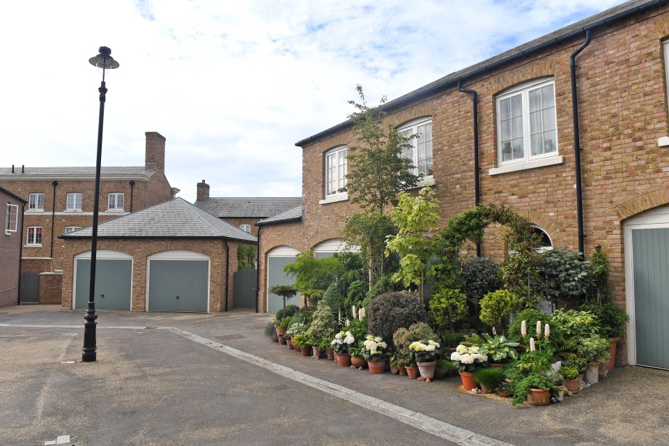 The plant-lover was told her garden in Prince Charles' model village of Poundbury, near Dorchester, was 'out of place'