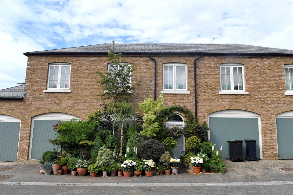 The gardener said she is 'heartbroken' after being told to cut back her flowery courtyard