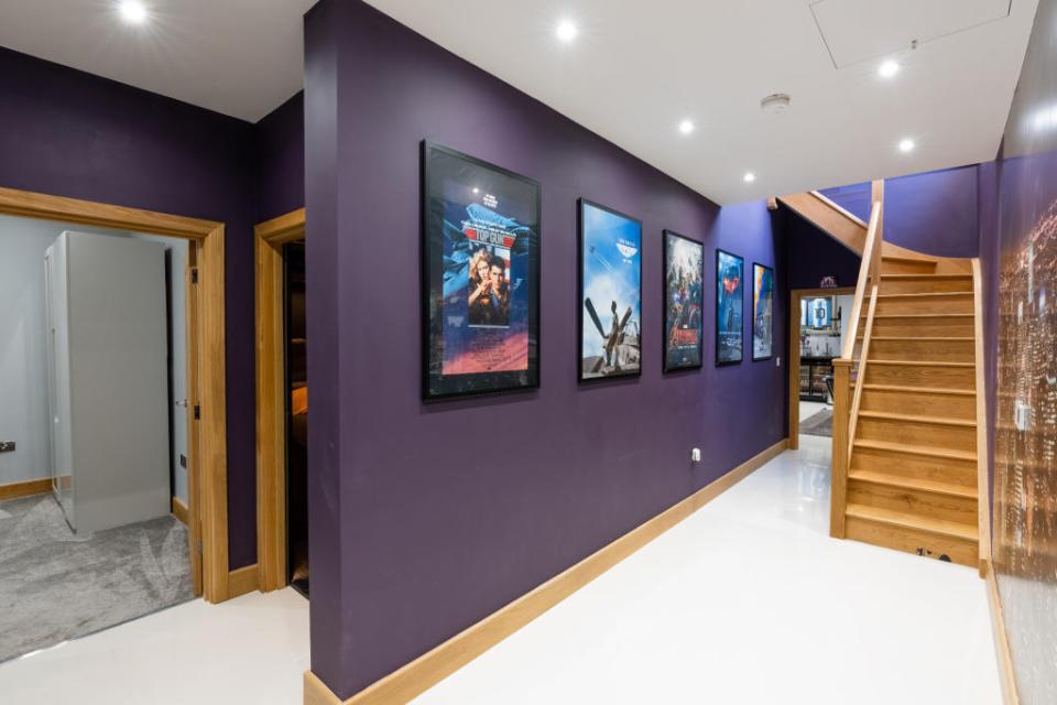 The incredible home has a cinema, pool table, gym and bar and is adorned with sporting memorabilia