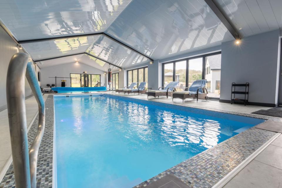 The detached pool room is a key feature of this property and houses the 11m x 3.75m heated swimming bath