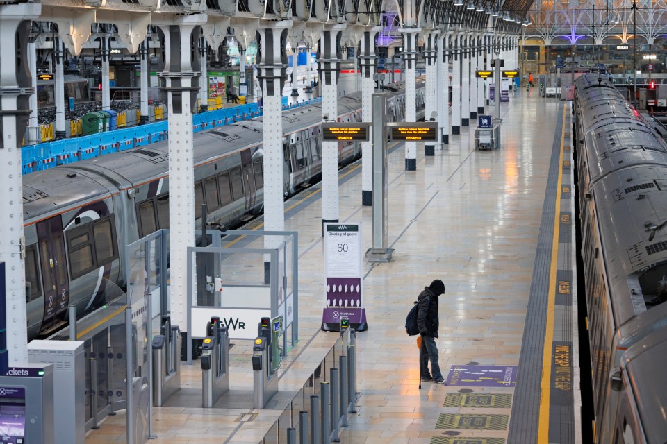 Trains waited at a deserted Paddington Station this morning