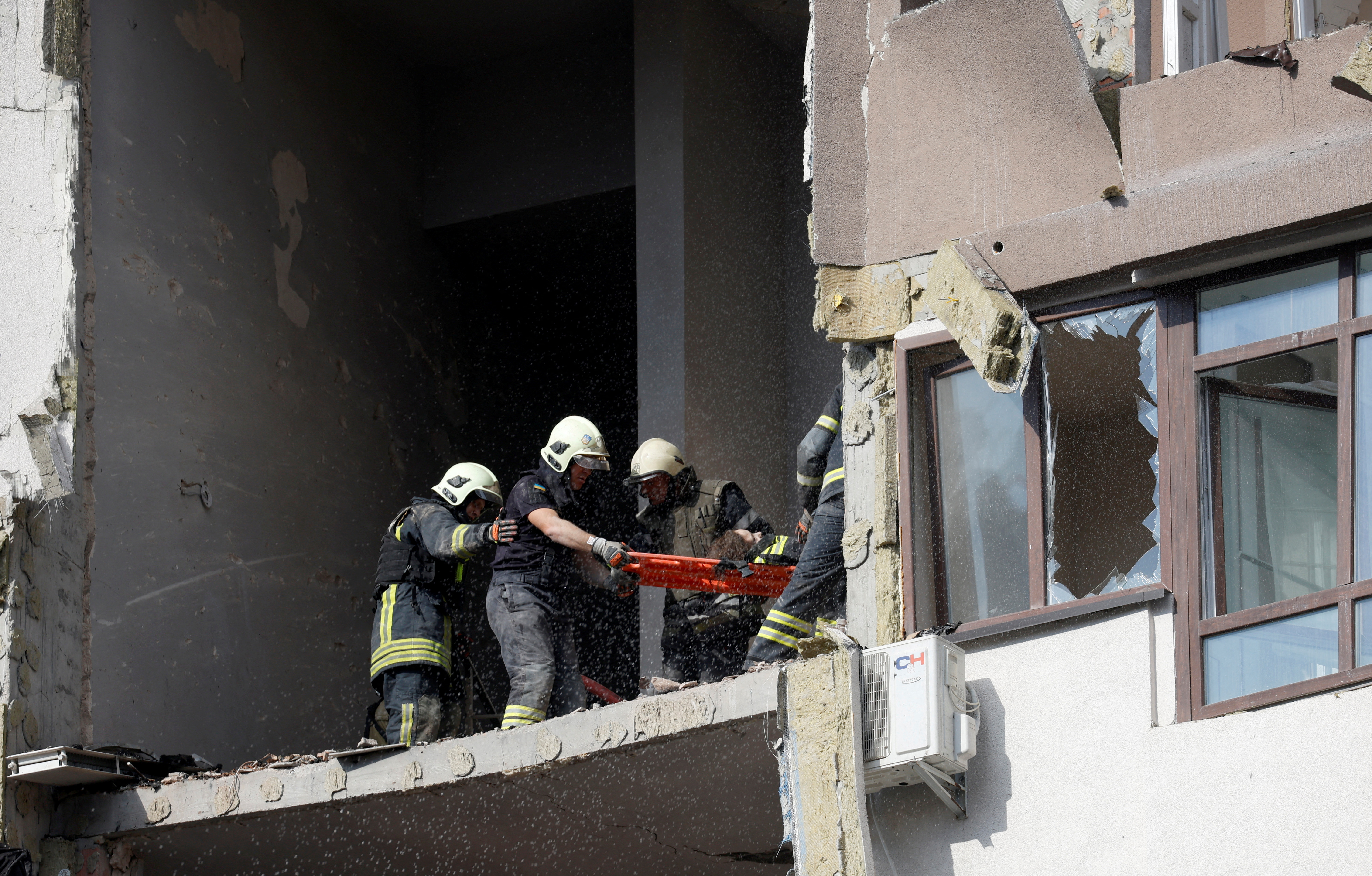 Emergency crews rescuing civilians from the rubble