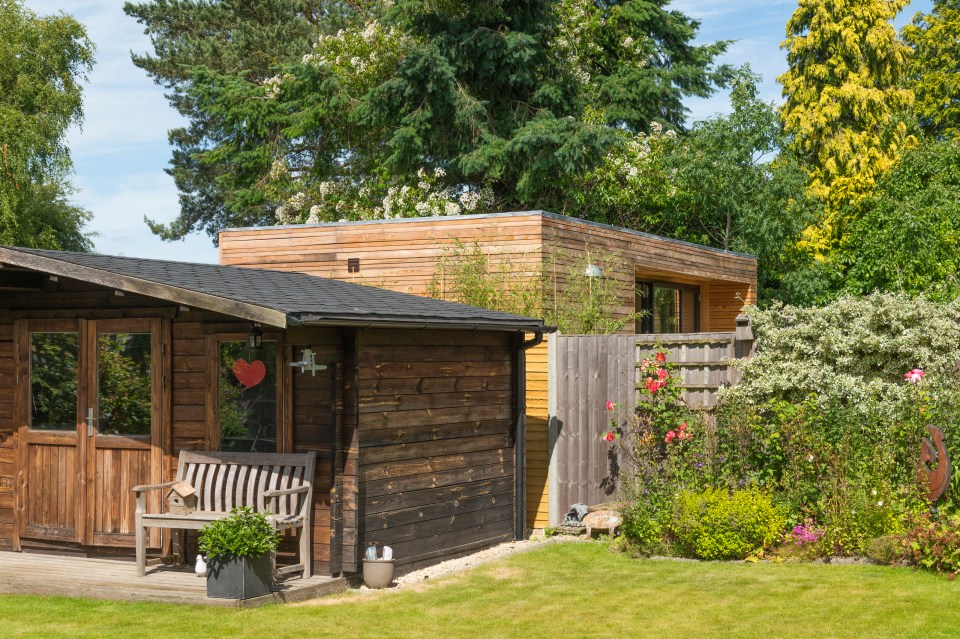 He has his own wooden cabin but is frustrated with his neighbour's bigger structure